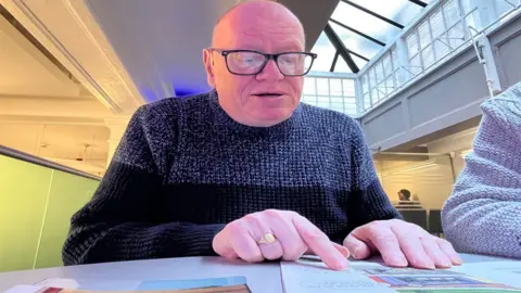 Kevin Shoesmith / BBC Graham North is learning to read at the age of 69