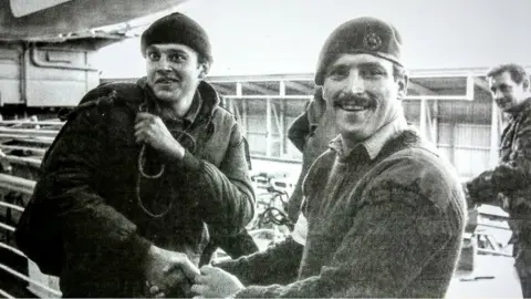 Brian Short  Giorgio Podesta (left) leaving the SS Canberra at Puerto Madryn