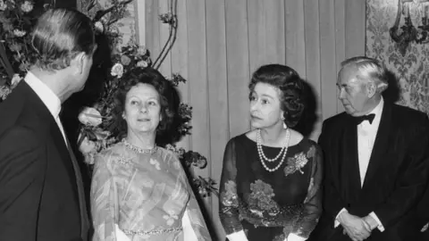 PA Mary Wilson with the Queen and husband Harold