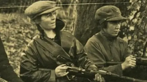 Linda Kerns, Eithne Coyle and Mae Burke at rifle practice in Duckett’s Grove, Carlow