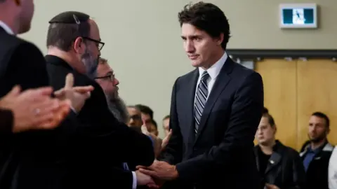 Reuters Canada's Prime Minister Justin Trudeau shakes hand with people attending a pro-Israel rally at the Soloway Jewish Community Centre in Ottawa, Ontario, Canada October 9, 2023.