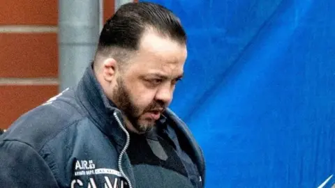 AFP Niels Högel is led out of court