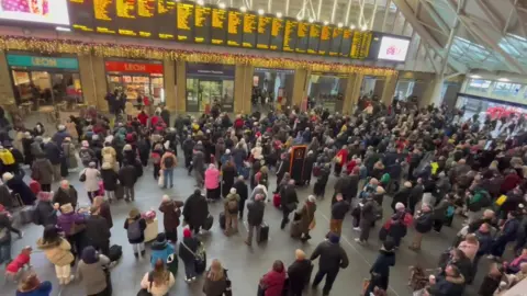 Passengers at King's Cross station on Monday 12 December