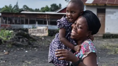 Woman holding a child