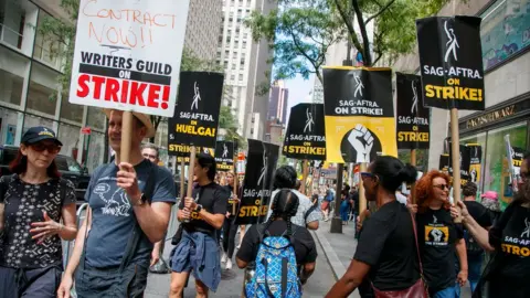 REX/Shutterstock A picket line in New York