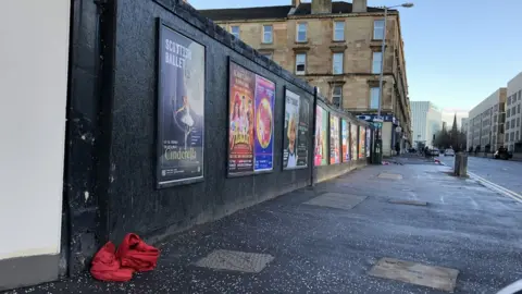 Zero Waste Scotland Suit discarded on pavement