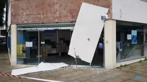 South Wales Police Barclays in Swansea with its sign torn off by the wind