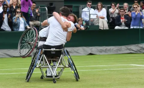 Getty Images Alfie Hewett and Gordon Reid celebrate winning the final of the men's wheelchair doubles at Wimbledon 2016