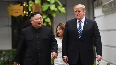 AFP US President Donald Trump (R) walks with North Korea's leader Kim Jong Un during a break in talks at the second US-North Korea summit at the Sofitel Legend Metropole hotel in Hanoi on 28 February, 2019.