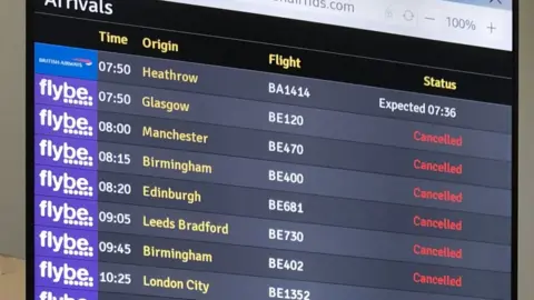 PA Media Destination board showing cancelled Flybe flights