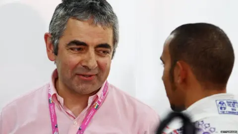 Getty Images Rowan Atkinson meeting F1 star Lewis Hamilton