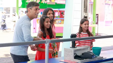 PA Media Rishi Sunak and family on holiday