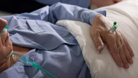 Patient in hospital bed