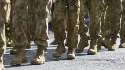 Getty Images Unidentified Australian soldiers take part in an Anzac Day march