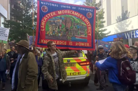 PA Protesters march in Preston in support of anti-fracking campaigners