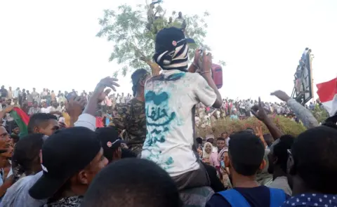 Ola Alsheikh A protester with the words "Halfa" on his T-shirt at a sit-in at the military HQ in Khartoum, Sudan - Monday 8 April 2019