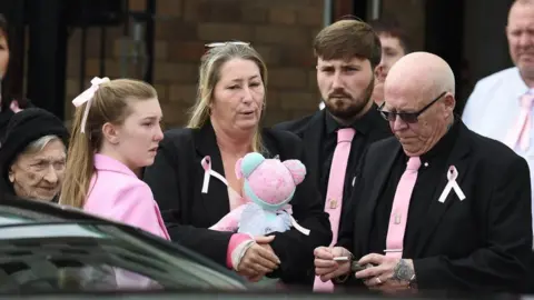 PA Media Olivia’s mother Cheryl Korbel (centre) at the funeral for Olivia Pratt-Korbel