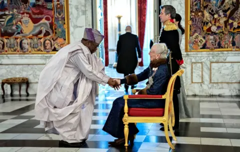 Reuters Benin"s ambassador to Denmark Eusebe Agbangla greets Denmark"s Queen Margrethe during the New Year"s reception at Christiansborg Palace in Copenhagen, Denmark, January 3, 2019