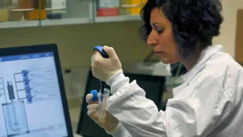 Getty Images A scientist researching a coronavirus vaccine