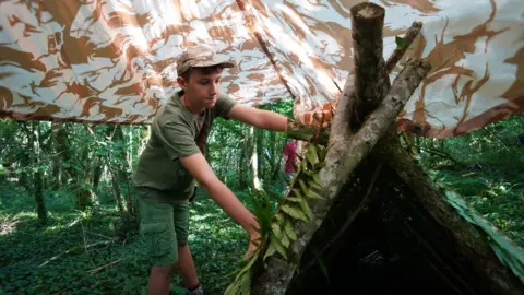 Seth Conway Max Woosey builds woodland shelter