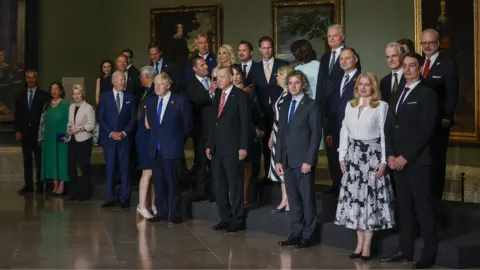 EPA Leaders at the Nato summit in Madrid pose for a group photo on 29 June