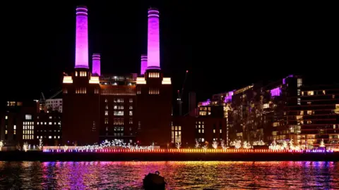 PA Media Battersea Power Station lit up in purple for Holocaust Memorial Day