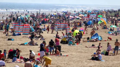 SOPA Images/Getty Images Skegness beach during the hot spell in June