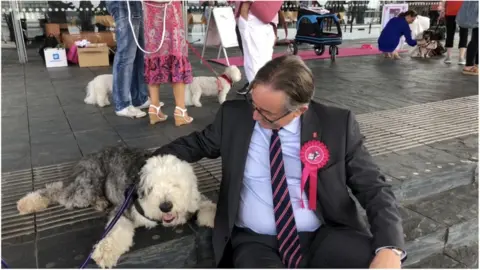 Cariad Mick Antoniw AM with one of the campaigner's dogs