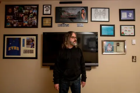 Louise Johns/BBC Steve Schaeffer has a shrine to his son in his apartment