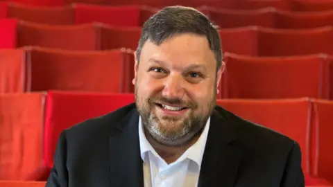 John Fairhall/BBC Michael Baldwin