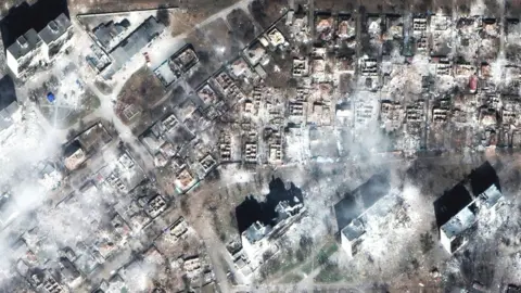 Maxar/ Getty Images Aerial view of devastated area of Mariupol, 29 March