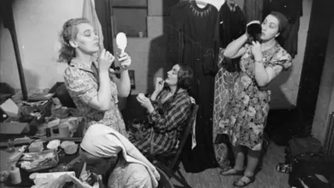 War Archive/Alamy Stock Photo A makeshift dressing room on an Old Vic tour