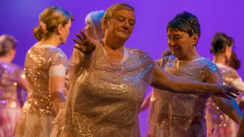 ID Event Photography Women in pink sparkly tops dance