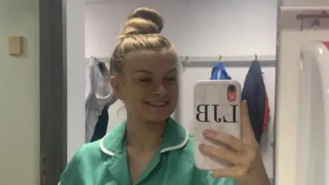 Leeoni Batty Leeoni taking her photograph in a mirror