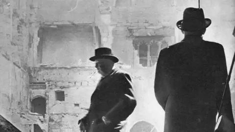 Getty Images Winston Churchill inspects bombed Commons