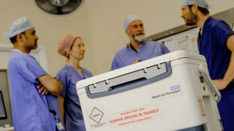 PA Media Organ donation container and hospital staff