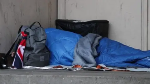 PA Homeless person sleeping rough in a doorway