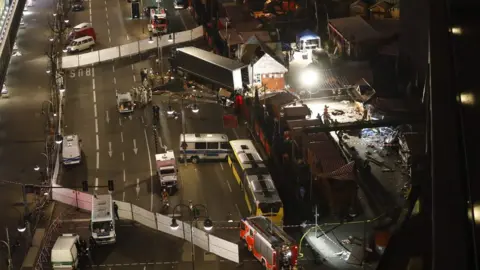 AFP Authorities inspecting a truck that had sped into a Christmas market in Berlin on 19 December 2016