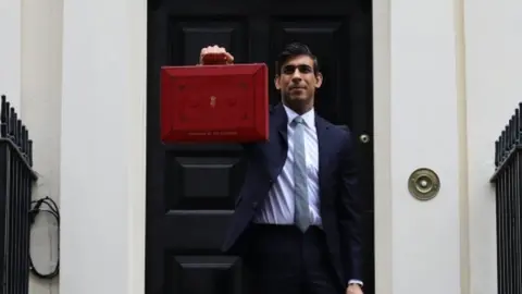 PA Media Chancellor Rishi Sunak leaving 11 Downing Street with his red box