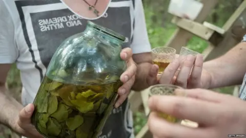 Getty Images Homebrew in a big jar