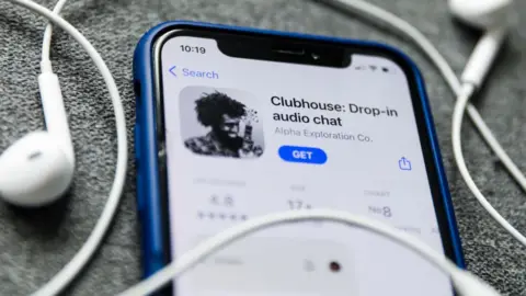 Getty Images Clubhouse Drop-in audio chat app logo on the App Store is seen displayed on a phone screen in this illustration photo taken in Poland on February 3, 2021.