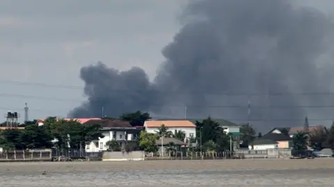 Reuters Smoke rises from Lagos mainland, Nigeria, October 21, 2020