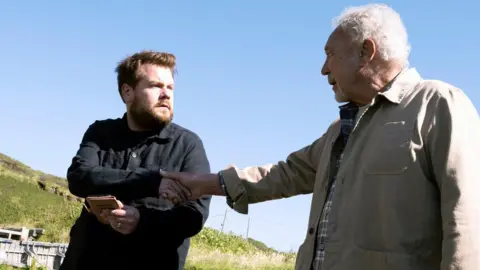 Amazon Studios/Dignity Prod Ltd James Corden and Sir Tom Jones