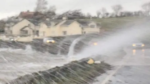 Ali McCrossan Waves batter the Portaferry Road on the Ards Peninsula