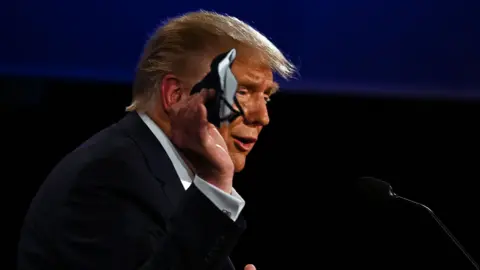 Getty Images Trump holding mask