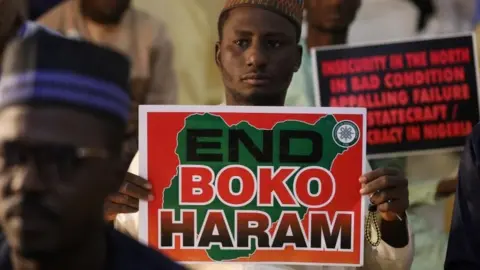 AFP Supporters of the "Coalition of Northern Groups" (CNG) rally to urge authorities to rescue hundreds of abducted schoolboys, in northwestern state of Katsina, Nigeria on December 17, 2020