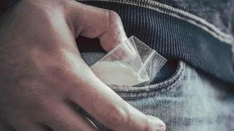 Getty Images Cocaine in a man's pocket