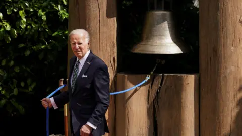 Reuters President Biden rings Bell of Peace