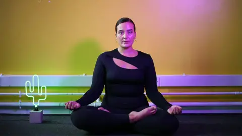 Nicki Briant doing yoga