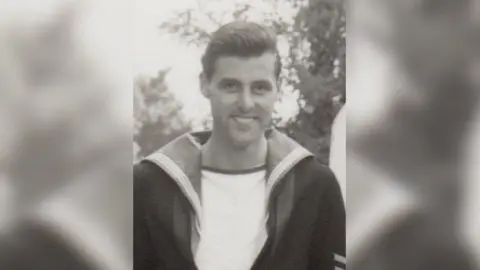 John Gibbs Black and white photo of John Gibbs in his Royal Navy uniform